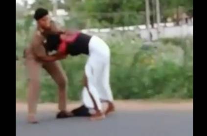 Police strikes down man for standing on road