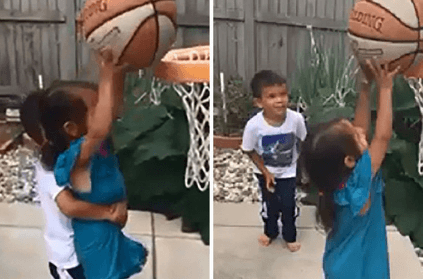 Brother helps his upset sister score a basket