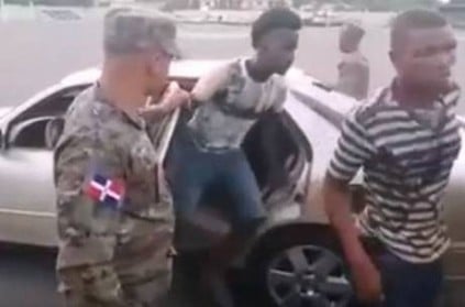 Dominican Republic - Soldier inspects car from which 18 people get out