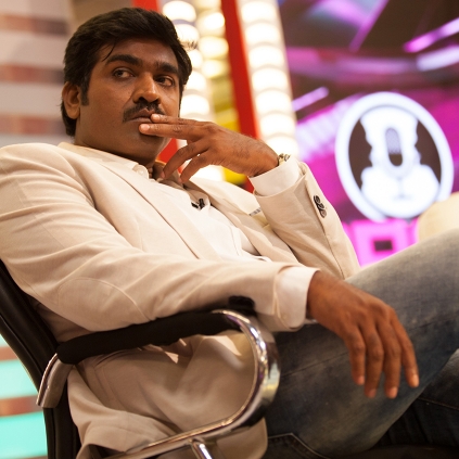 Vijay Sethupathi sits on the floor of the stage to answer his fans